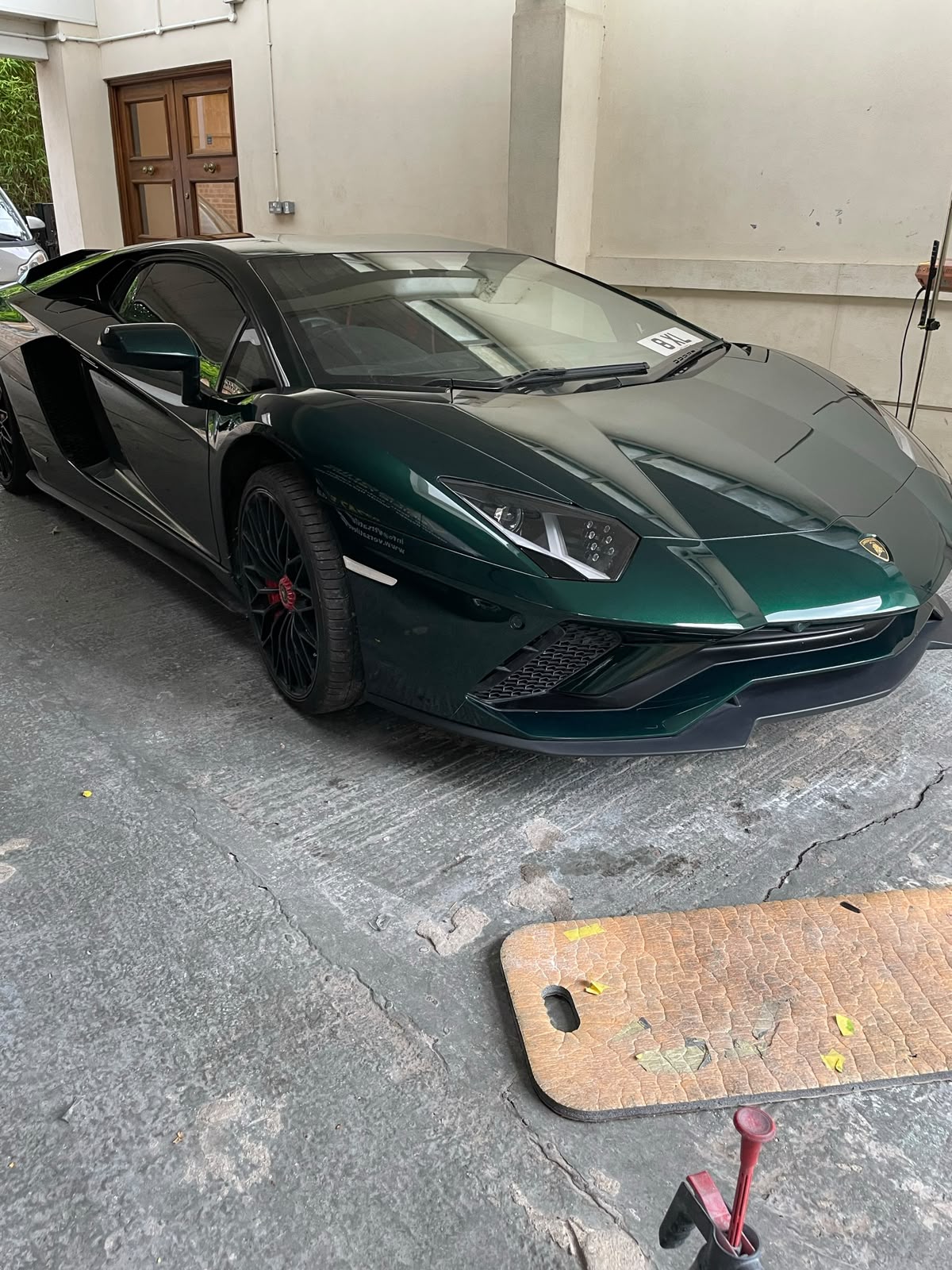 Green Lamborghini Aventador S after paintwork at the bodyshop