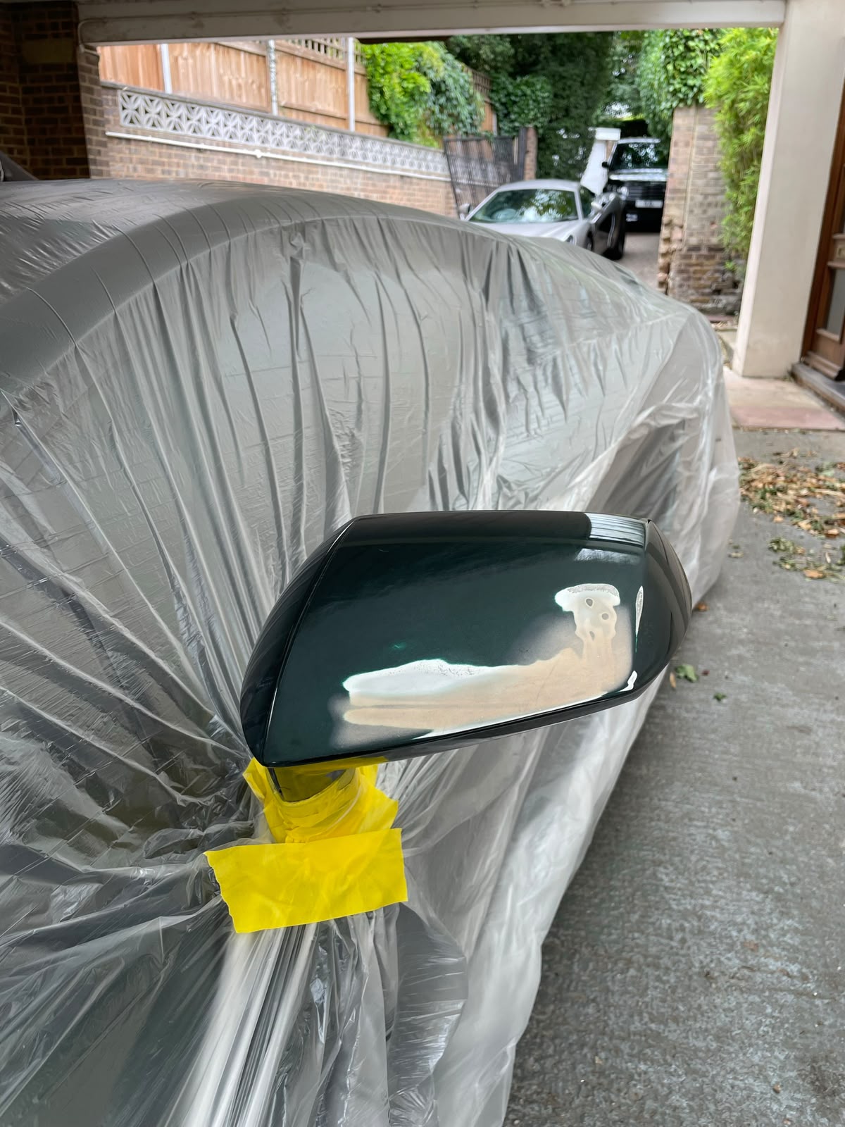 Lamborghini wing mirror respray before and after - before
